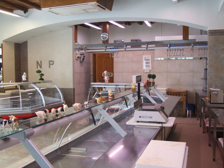 'Roussounelos Meat Market' store with empty refrigerating showcases